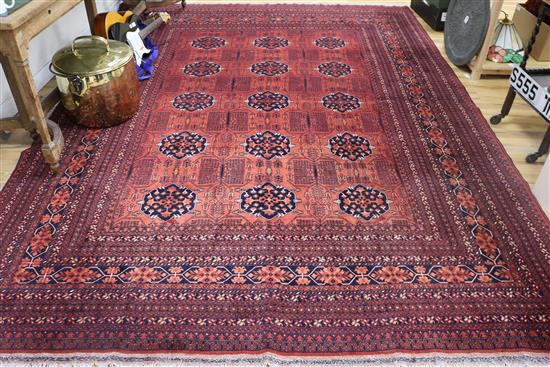 A red ground Bokhara rug 340cm x 240cm